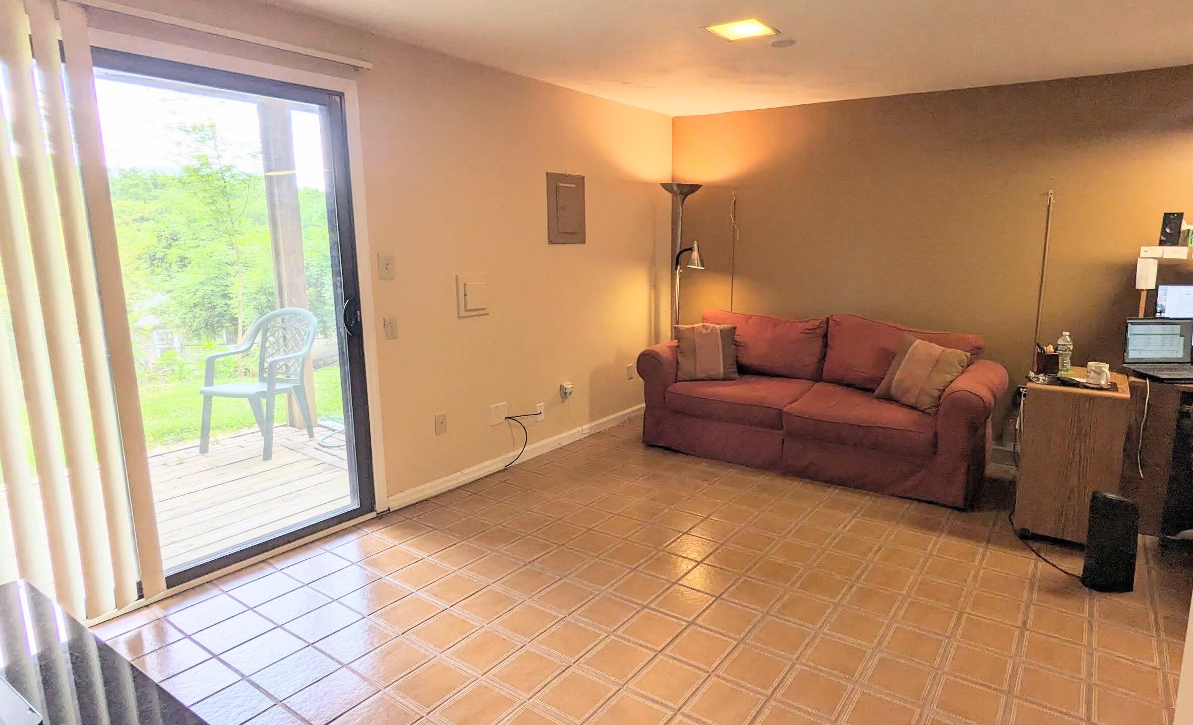 3420 Morning Dove Road Roanoke, VA 24018 - Photo 27 of 33 a living room with furniture and a floor to ceiling window