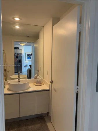a bathroom with a sink and a mirror