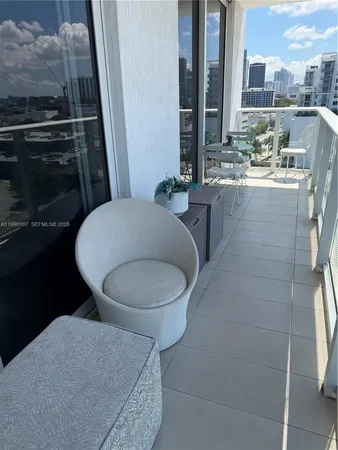 a bathroom with a granite countertop toilet sink and mirror