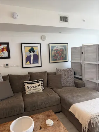 a living room with furniture and a couch