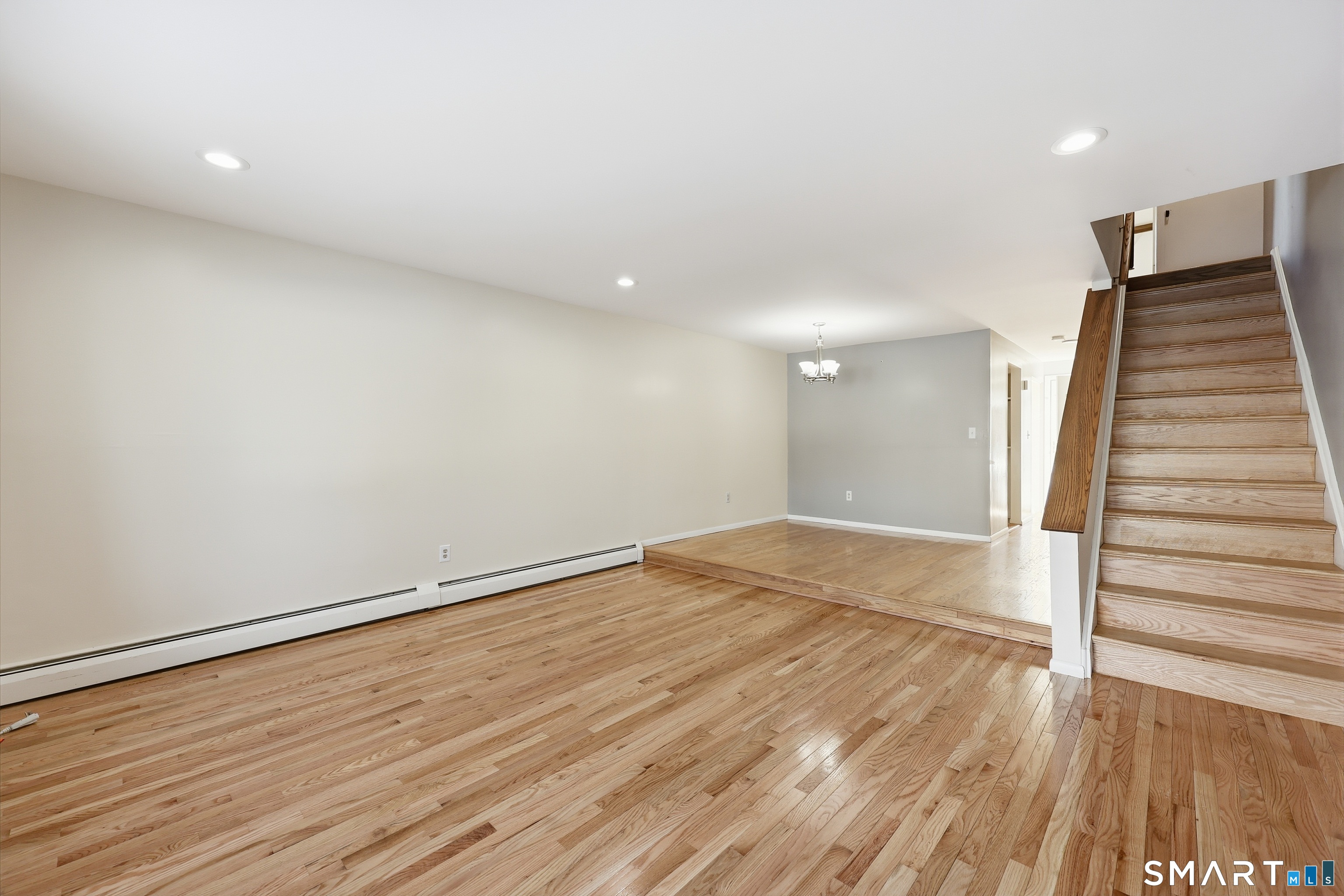 220 Main Street, Unit 2J New Hartford, CT 06057 - Photo 11 of 29 a view of an empty room with wooden floor
