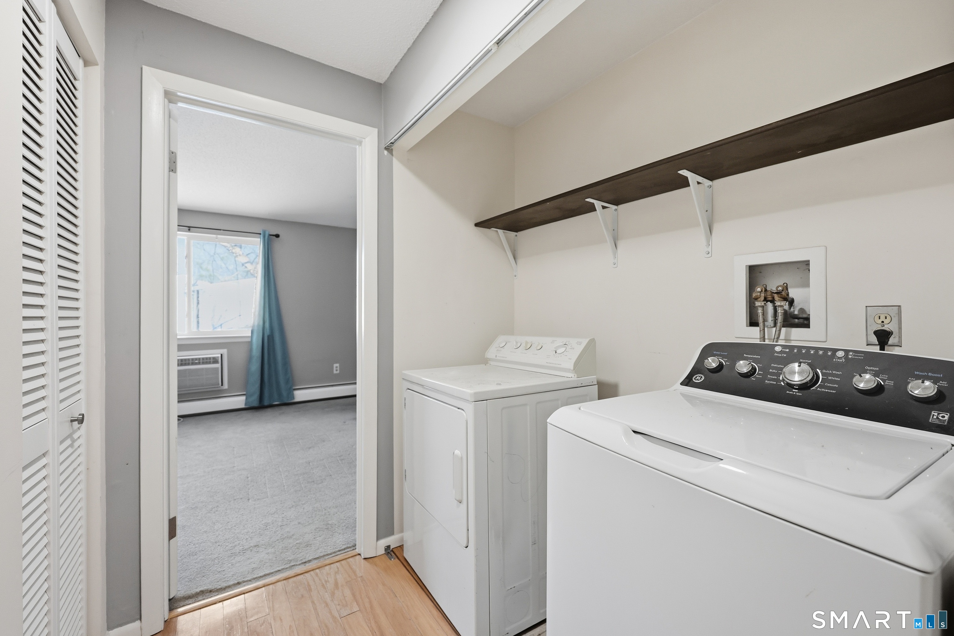 220 Main Street, Unit 2J New Hartford, CT 06057 - Photo 18 of 29 a view of storage and utility room with washer and dryer