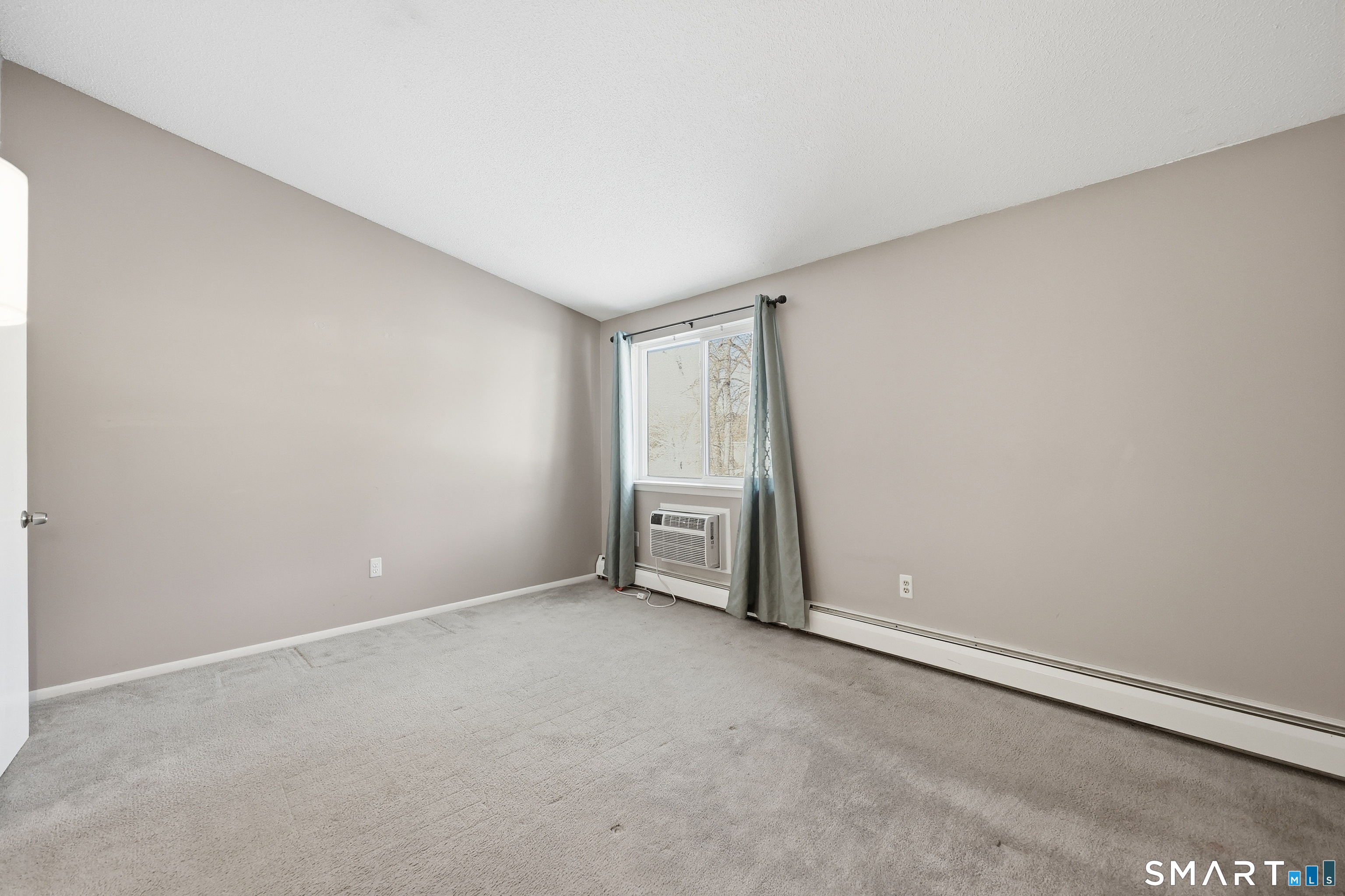 220 Main Street, Unit 2J New Hartford, CT 06057 - Photo 19 of 29 a view of an empty room