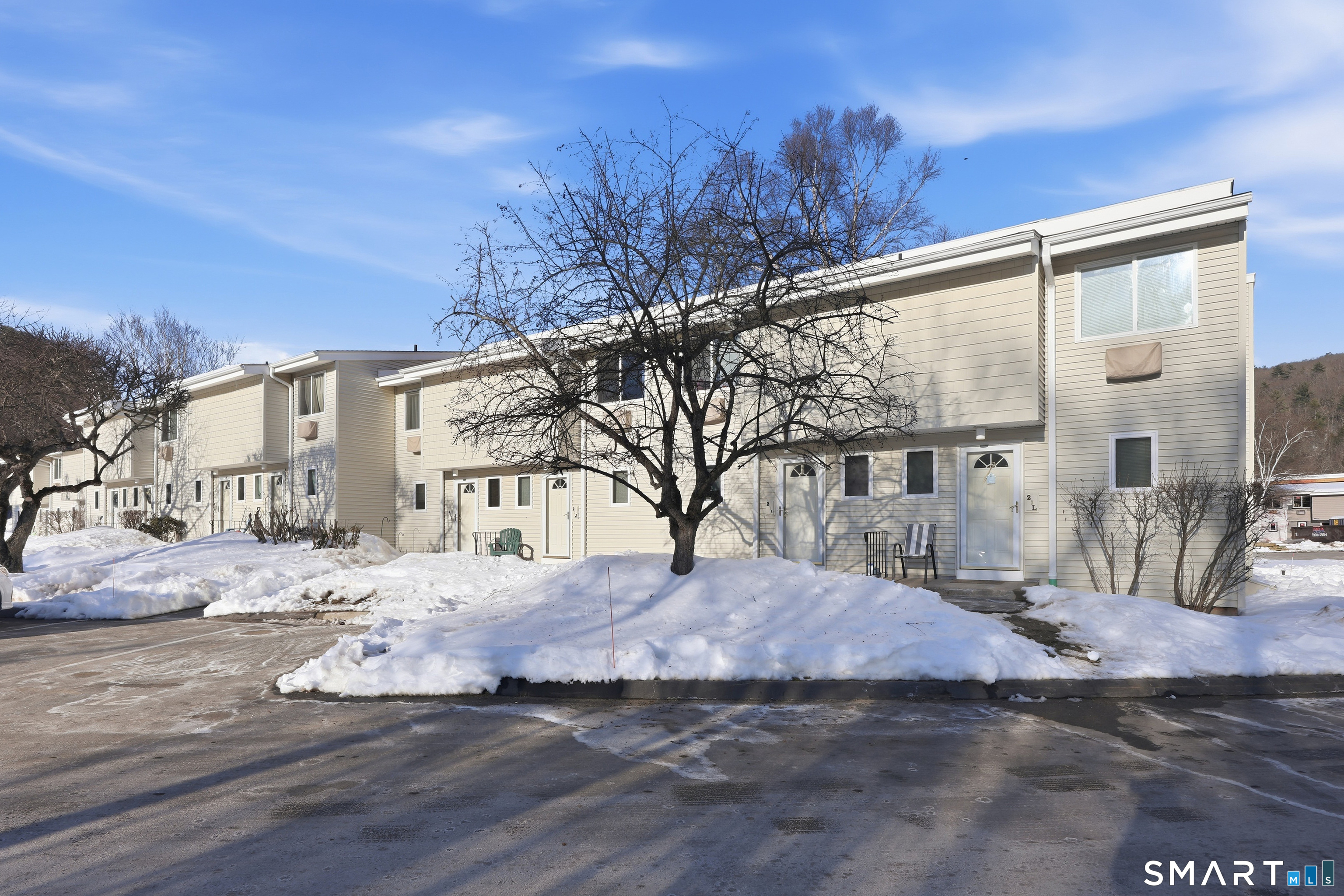 220 Main Street, Unit 2J New Hartford, CT 06057 - Photo 2 of 29 a view of large house with a yard