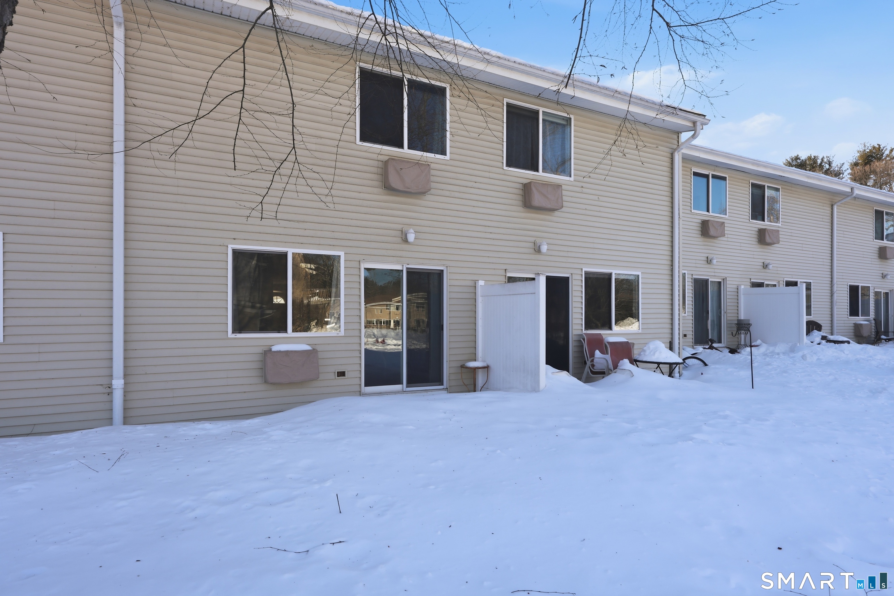 220 Main Street, Unit 2J New Hartford, CT 06057 - Photo 27 of 29 a view of a house with patio