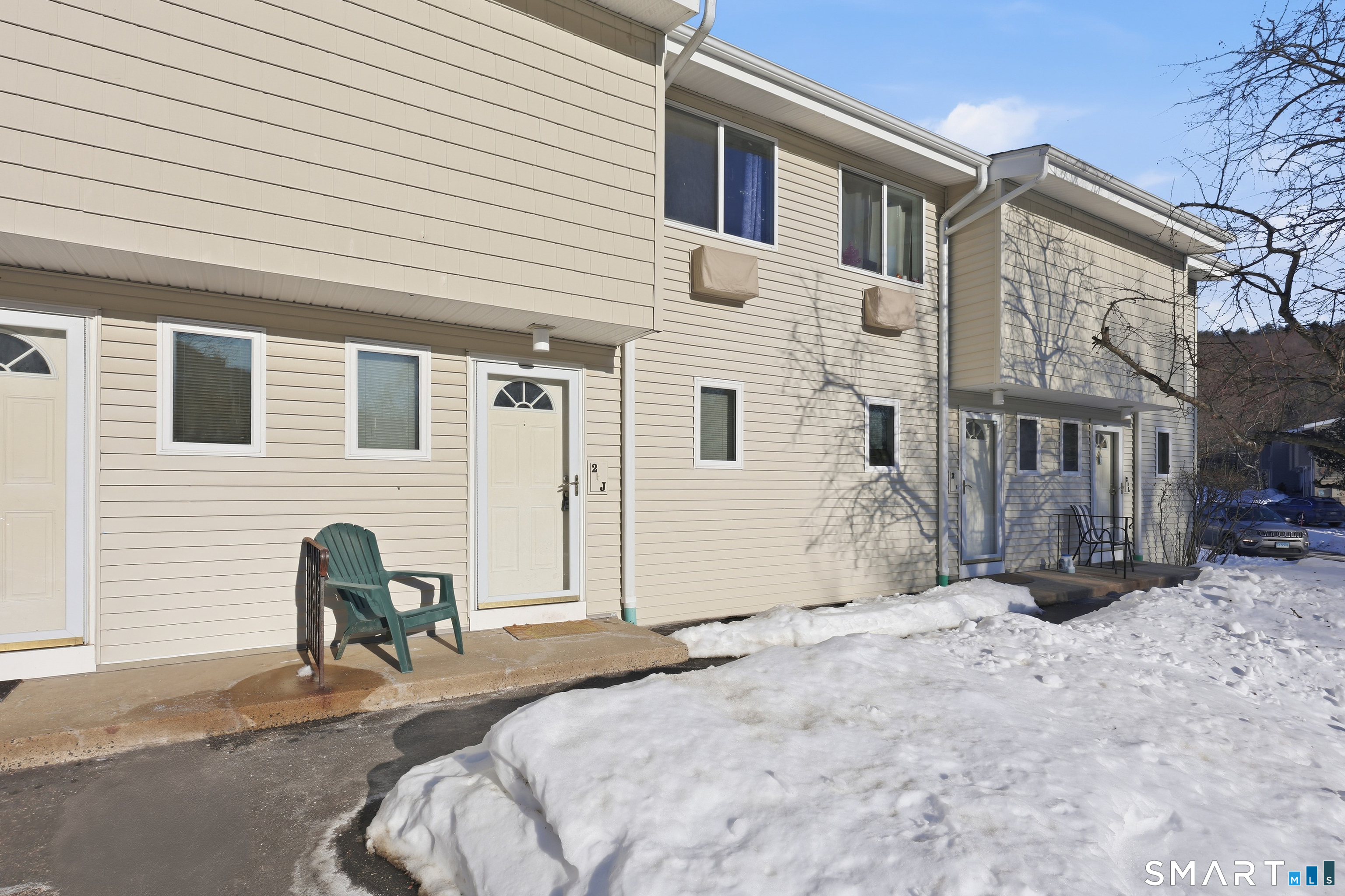 220 Main Street, Unit 2J New Hartford, CT 06057 - Photo 3 of 29 a view of backyard of a house