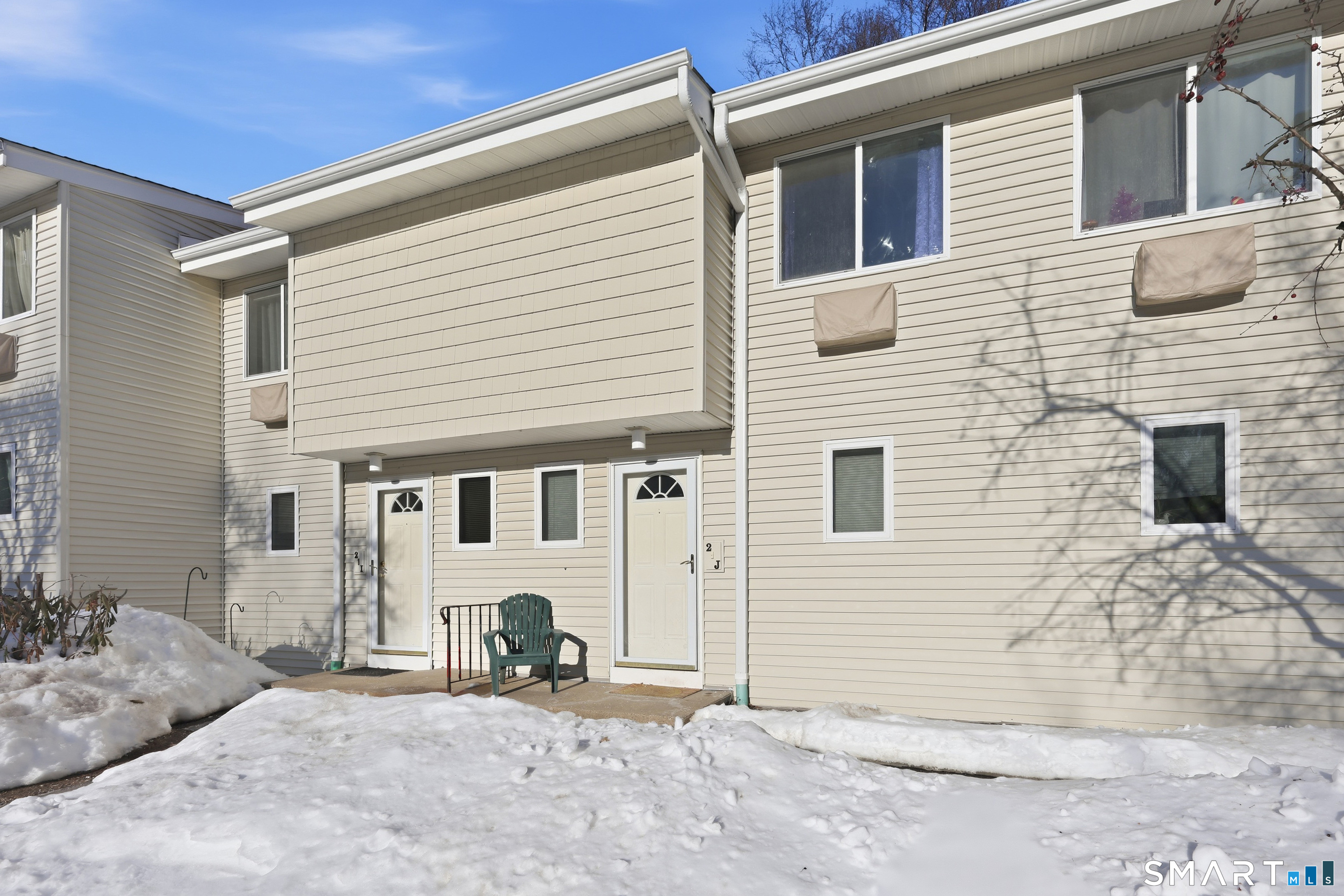 220 Main Street, Unit 2J New Hartford, CT 06057 - Photo 4 of 29 a view of a house with a yard
