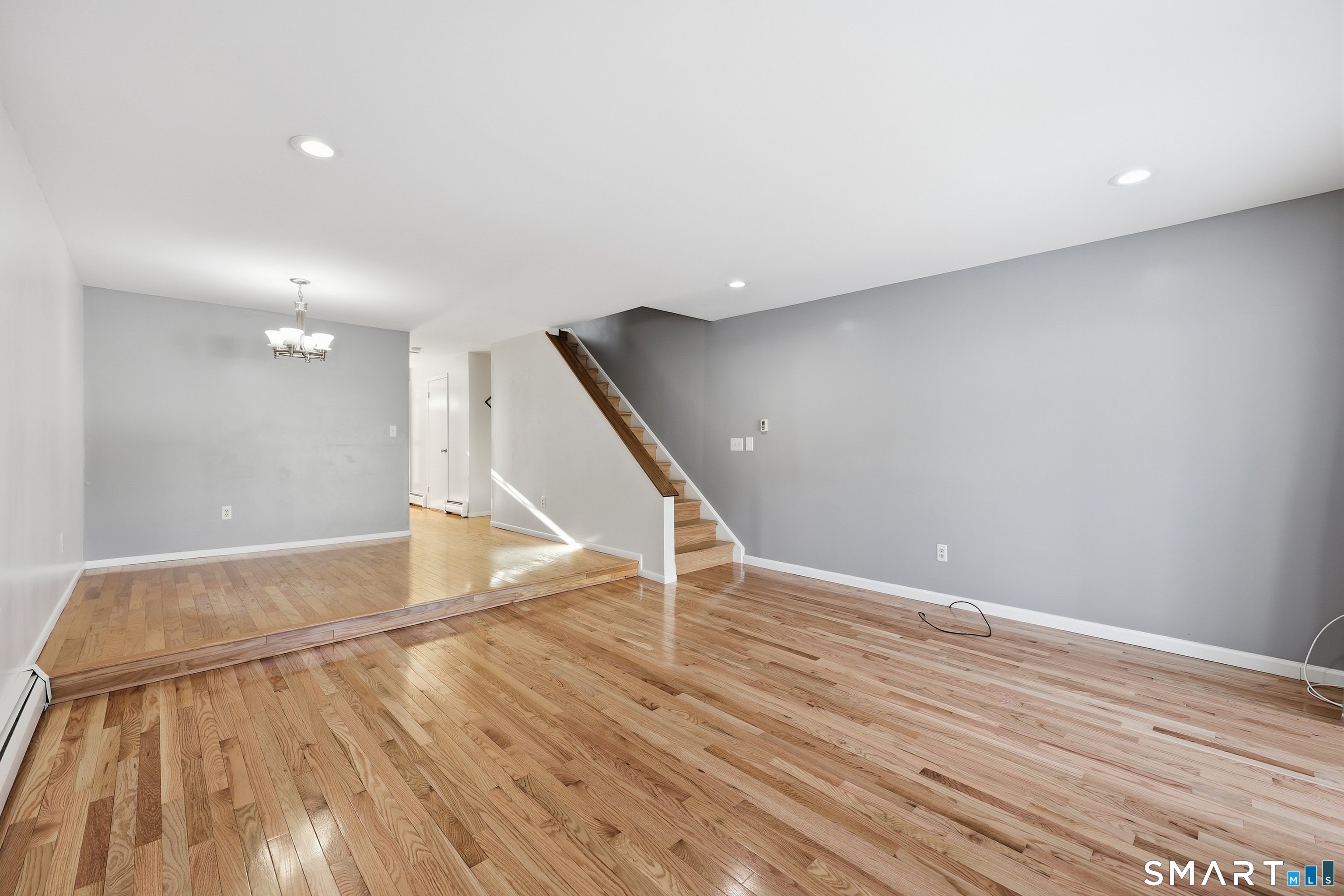 220 Main Street, Unit 2J New Hartford, CT 06057 - Photo 10 of 29 a view of an empty room with wooden floor