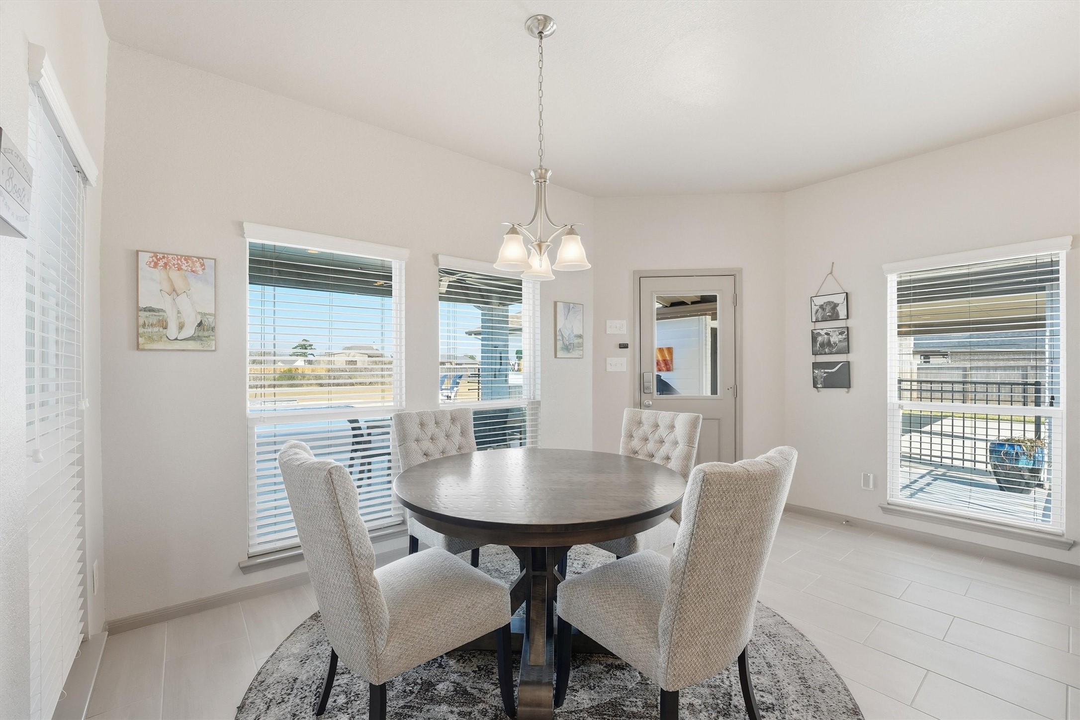 4735 Camp Creek Road Baytown, TX 77523 - Photo 13 of 41 a view of a dining room with furniture window and wooden floor