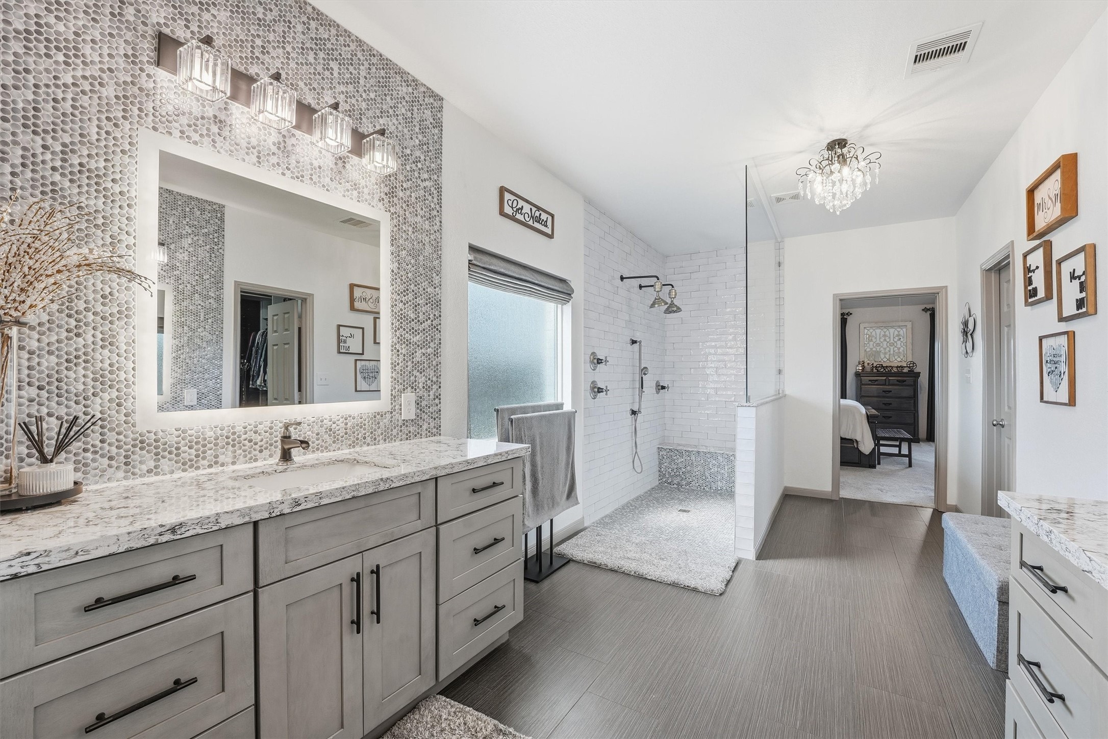 4735 Camp Creek Road Baytown, TX 77523 - Photo 16 of 41 a spacious bathroom with a granite countertop sink mirror and a shower