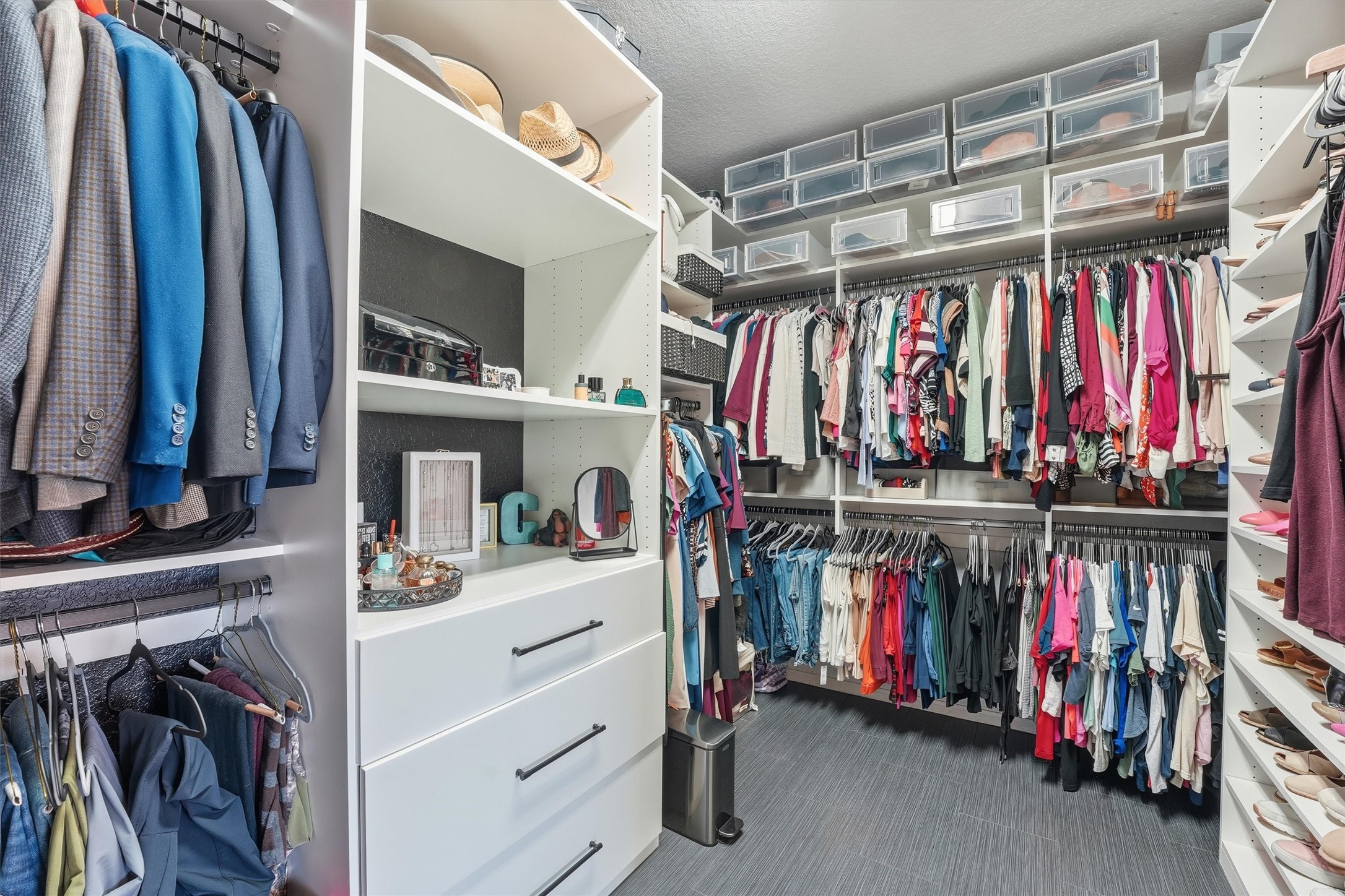 4735 Camp Creek Road Baytown, TX 77523 - Photo 20 of 41 a view of walk in closet with clothes and shoes
