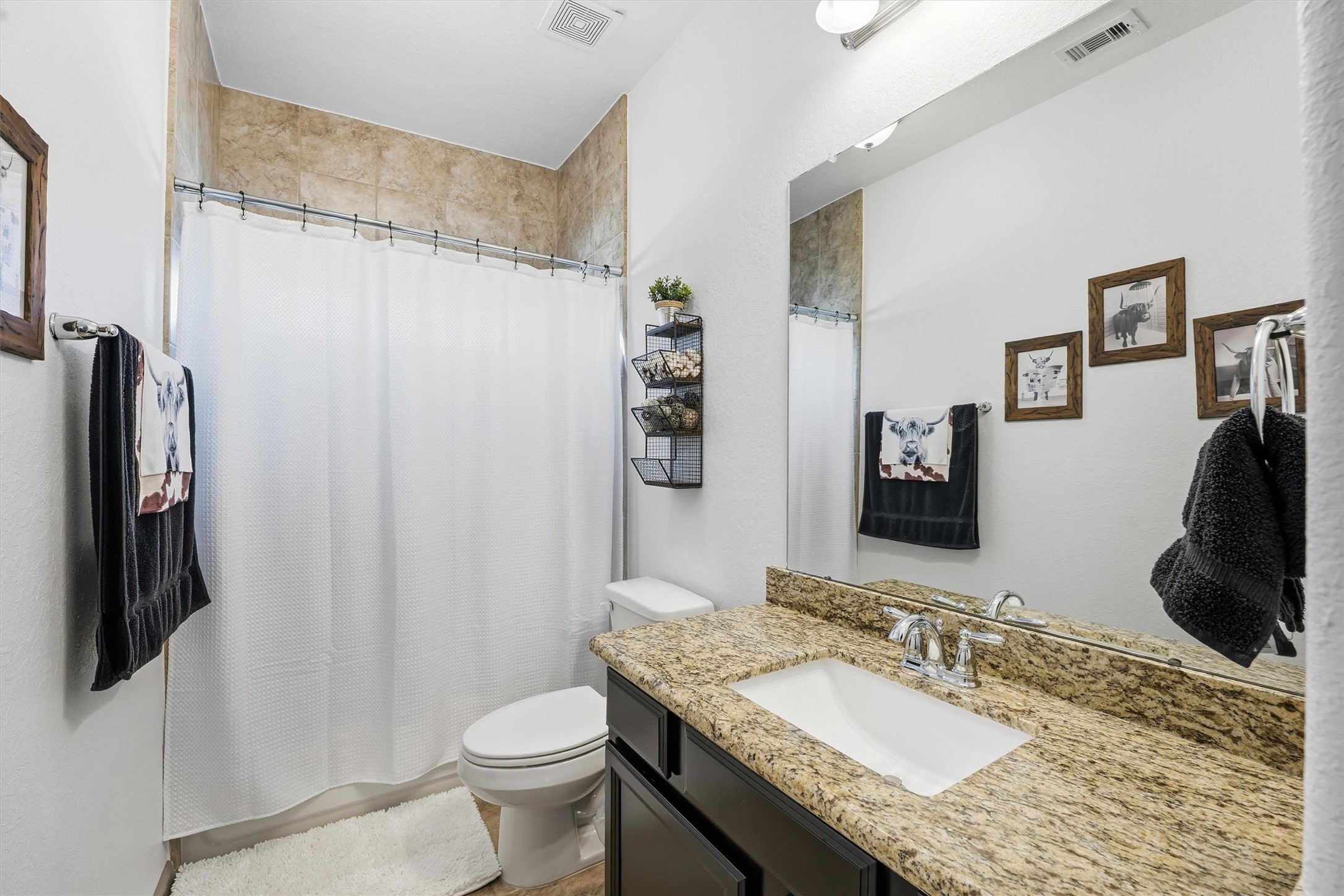 4735 Camp Creek Road Baytown, TX 77523 - Photo 22 of 41 a bathroom with a granite countertop sink toilet and shower