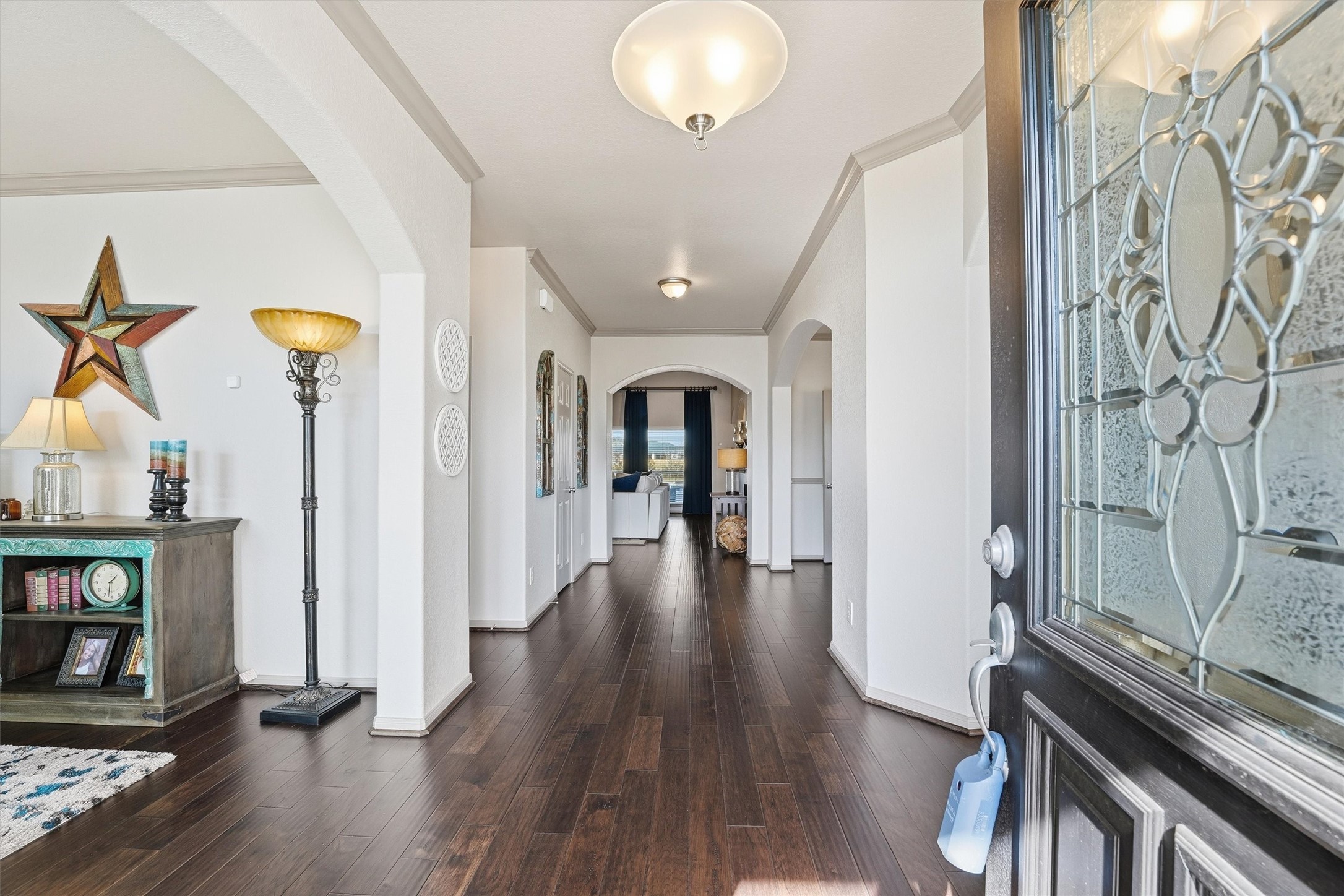 4735 Camp Creek Road Baytown, TX 77523 - Photo 26 of 41 a view of a hallway with wooden floor and staircase