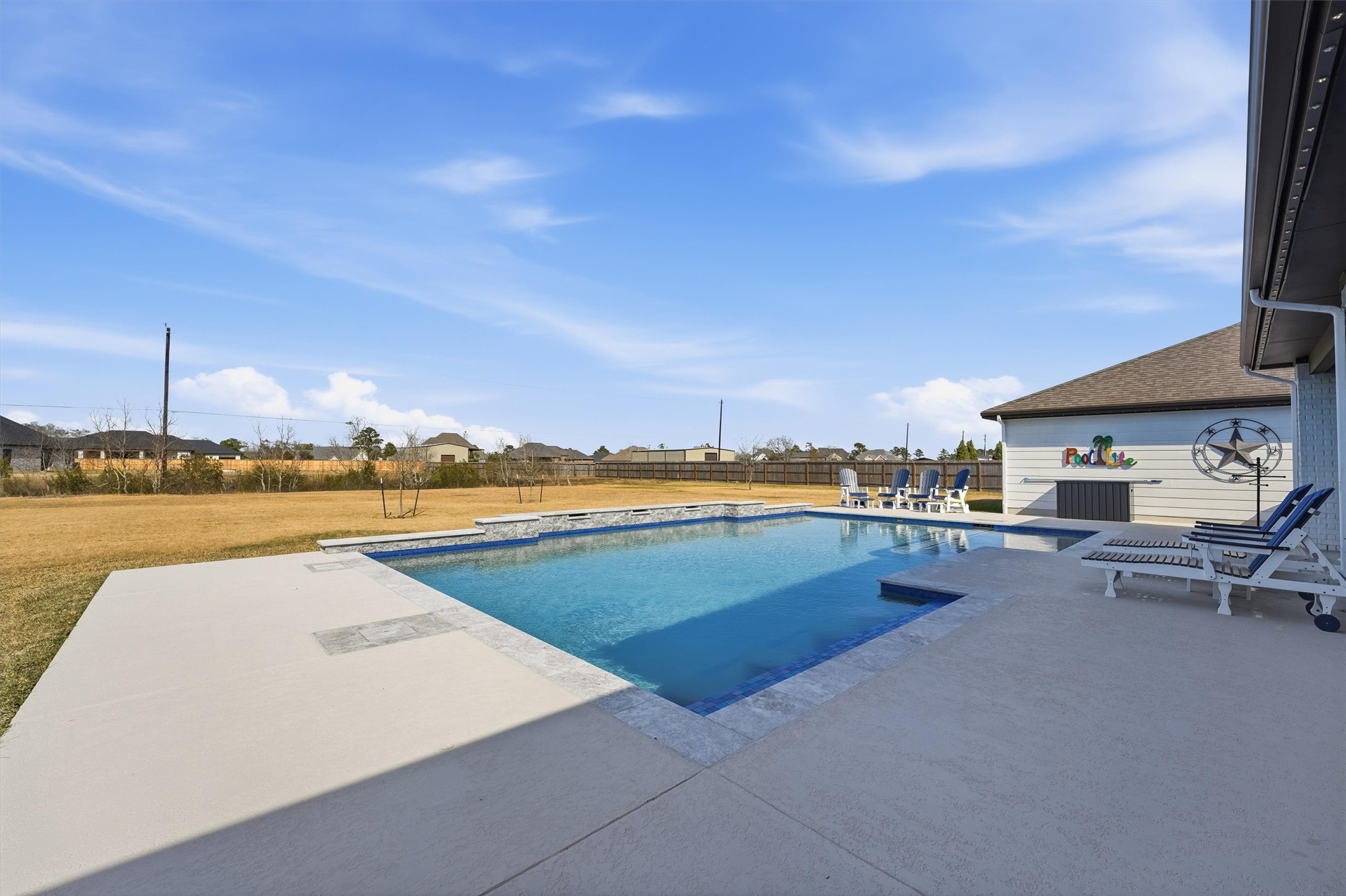 4735 Camp Creek Road Baytown, TX 77523 - Photo 29 of 41 a view of swimming pool with outdoor seating and yard in back