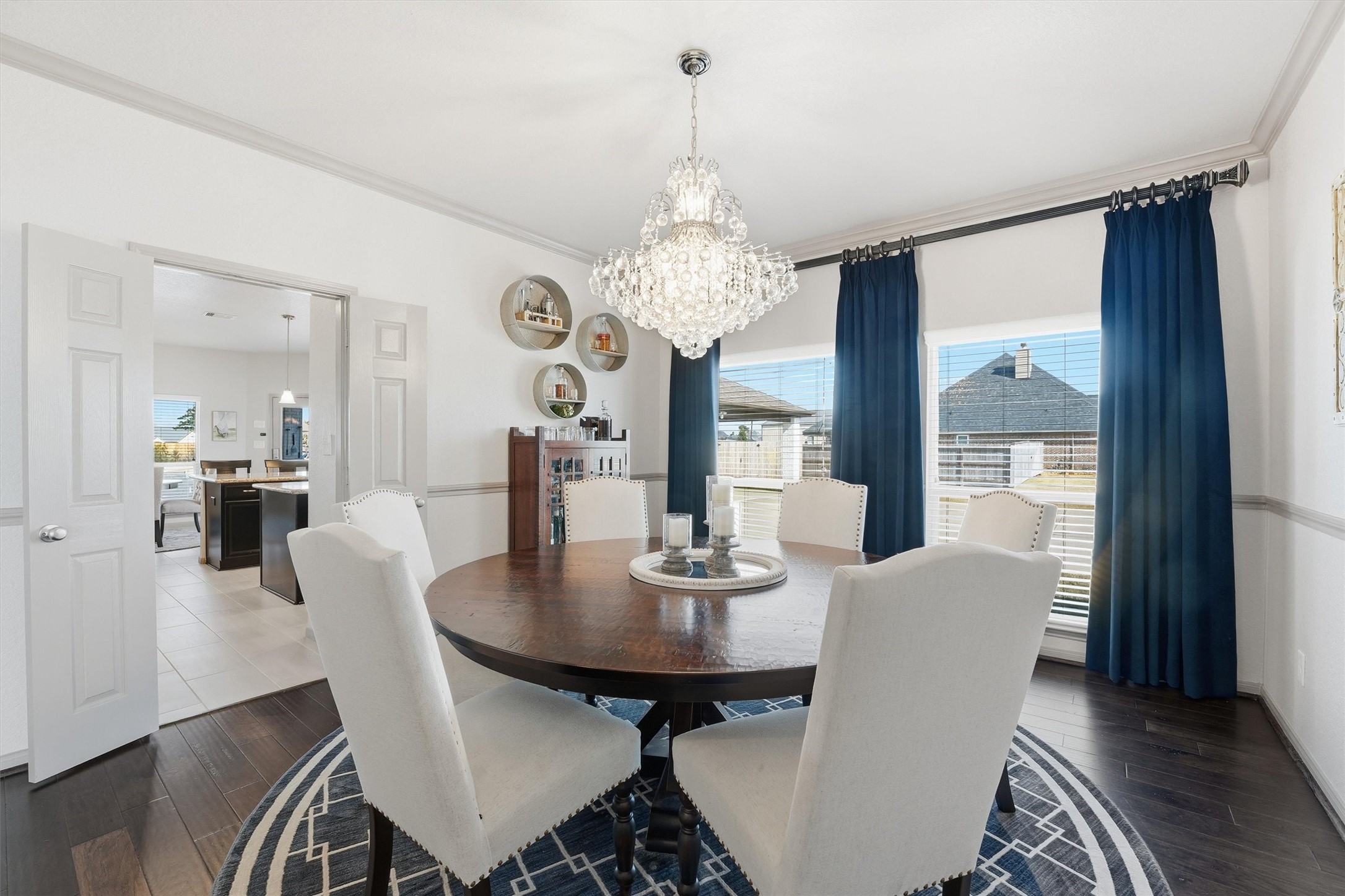 4735 Camp Creek Road Baytown, TX 77523 - Photo 5 of 41 a view of a dining room with furniture wooden floor and chandelier
