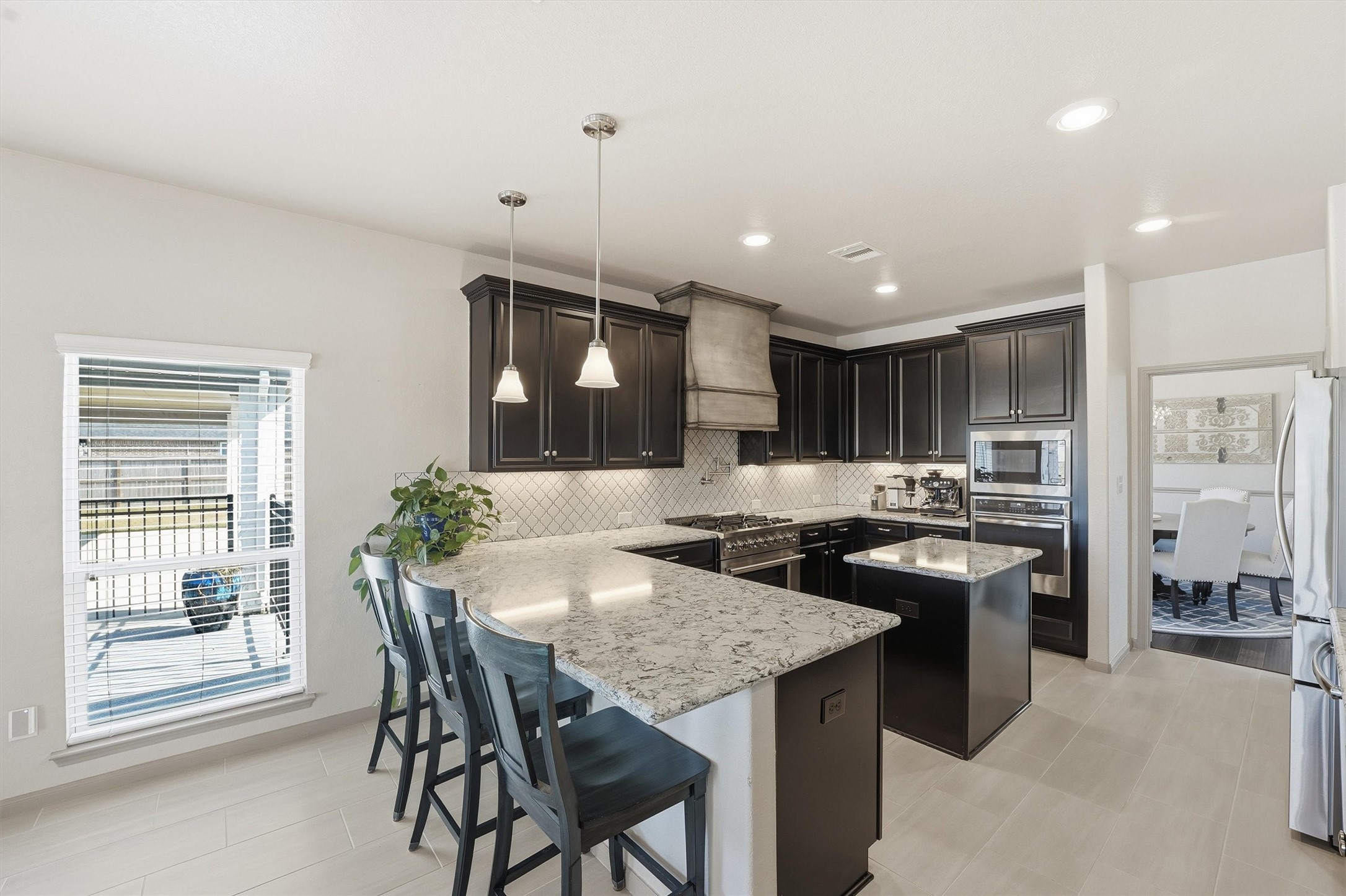 4735 Camp Creek Road Baytown, TX 77523 - Photo 7 of 41 a kitchen with a table and chairs in it