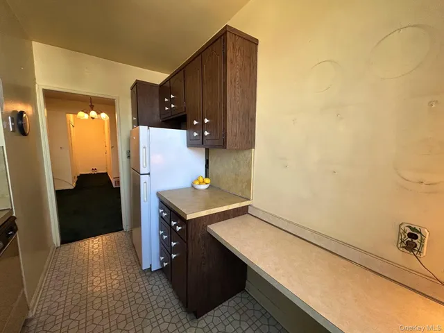 a kitchen with a stove and a refrigerator