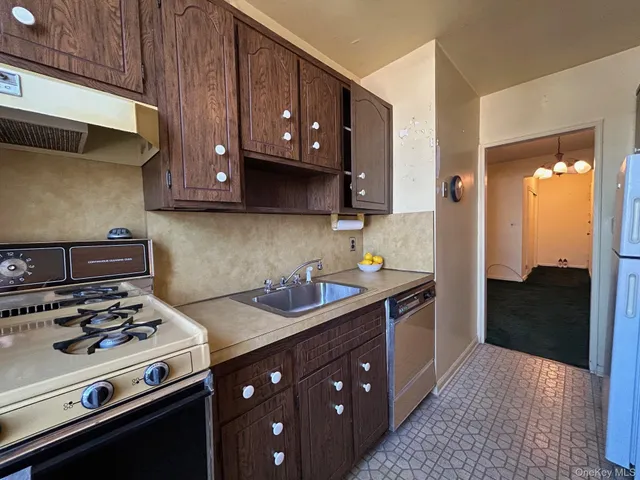a living room with furniture a rug and a wall painting