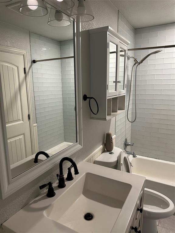 232 Samuel Boulevard, Unit 2 Coppell, TX 75019 - Photo 15 of 19 a bathroom with a sink and a mirror