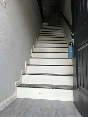 a view of kitchen with stainless steel appliances granite countertop a stove top oven