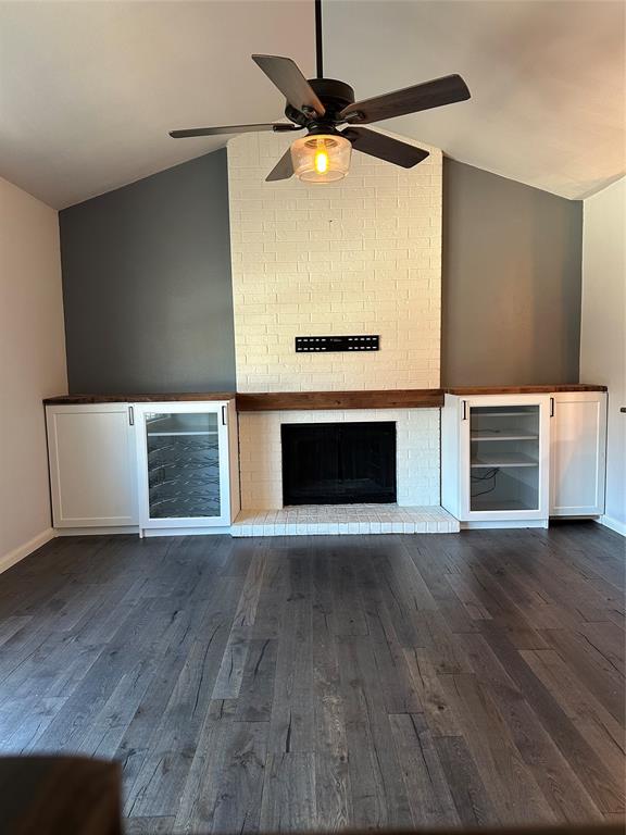 232 Samuel Boulevard, Unit 2 Coppell, TX 75019 - Photo 8 of 19 a view of an empty room with a fireplace and a window