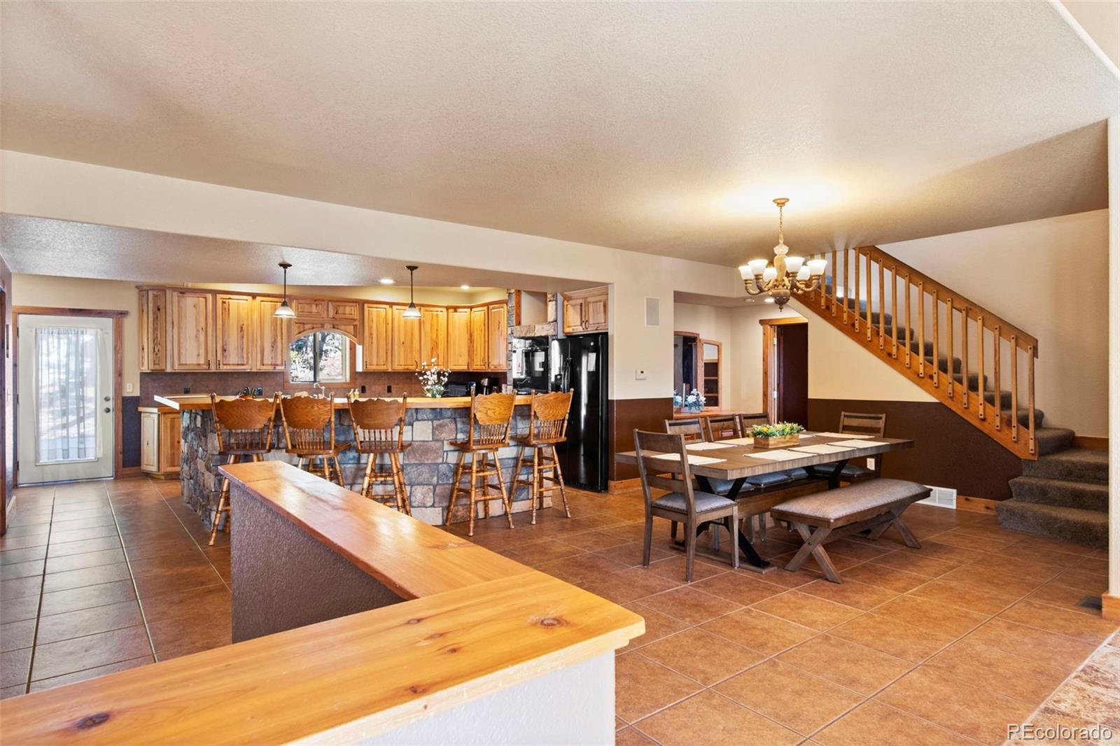 412 Evergreen Road Black Hawk, CO 80422 - Photo 11 of 48 a living room with lots of furniture and view of kitchen