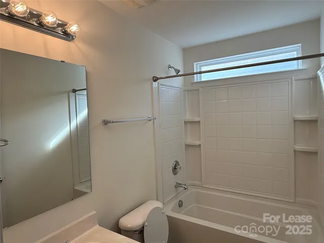 a bathroom with a shower and bathtub