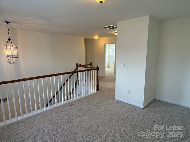 a view of a hallway with closet area