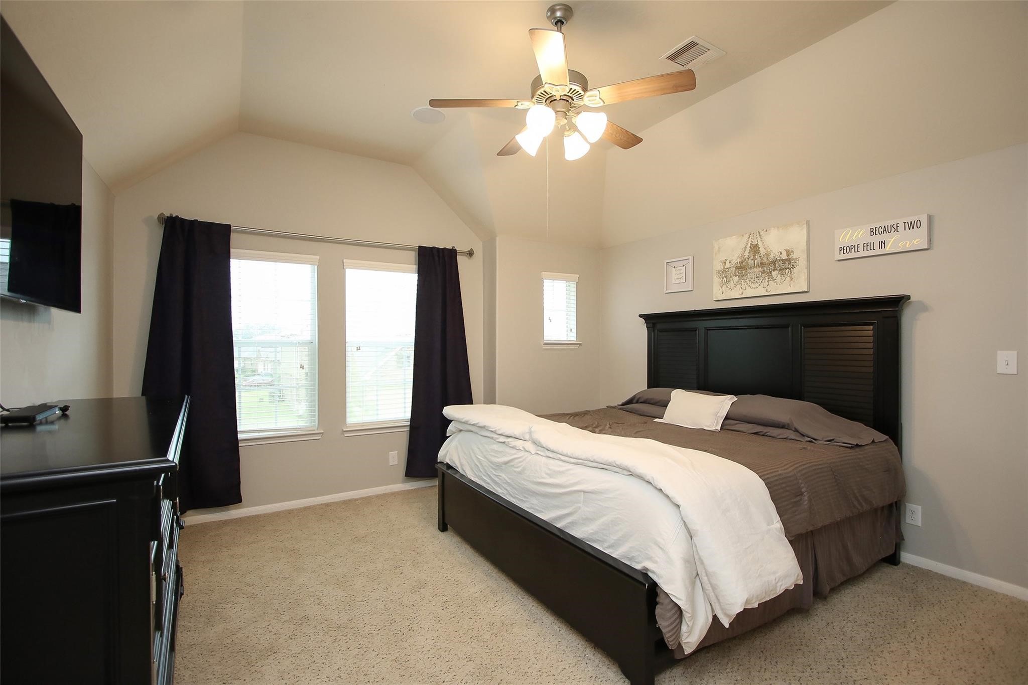 8517 Sunset Loch Drive Spring, TX 77379 - Photo 14 of 22 a bedroom with a large bed and a window