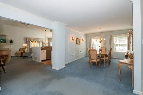 a view of a livingroom with furniture and a window