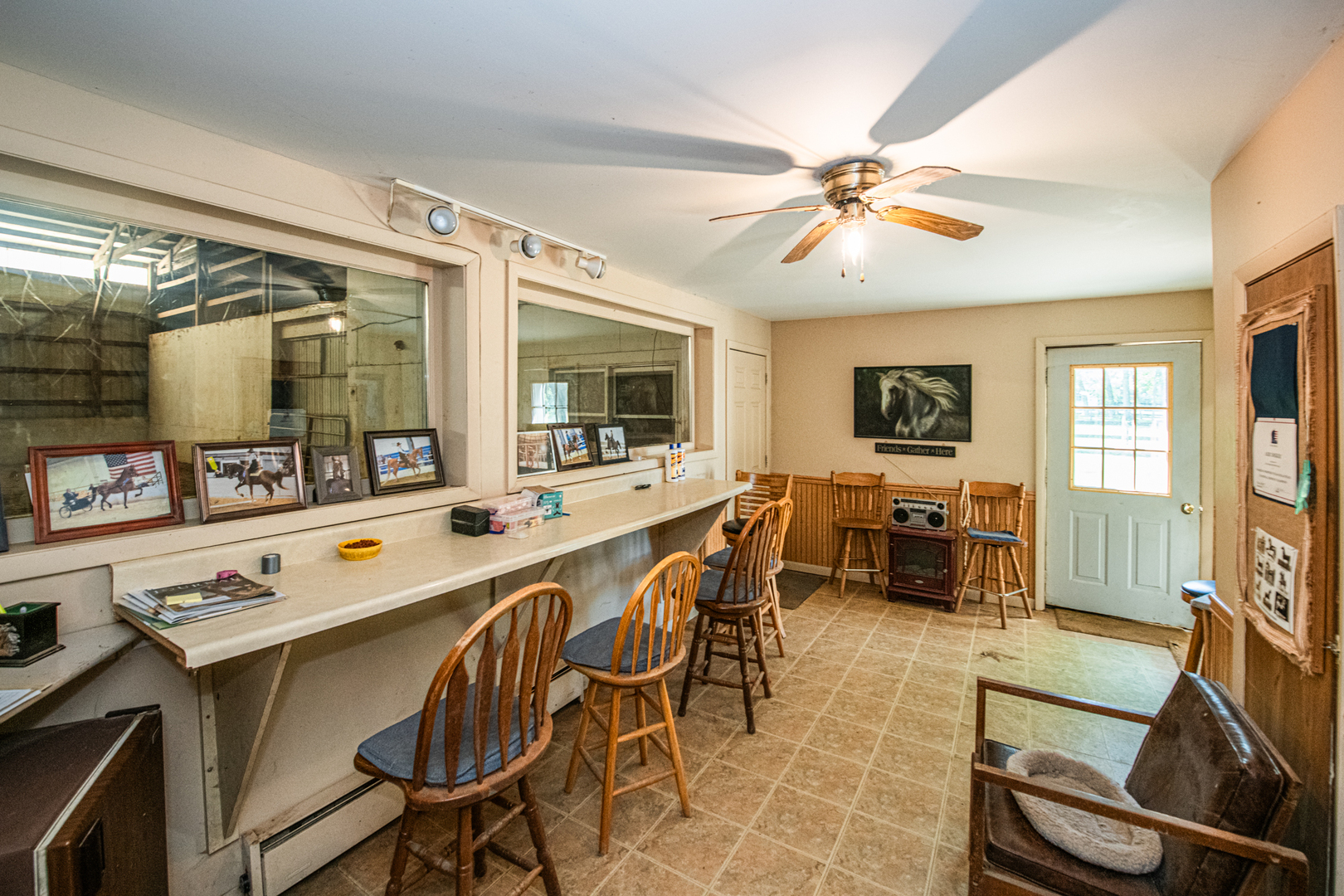 27490 West Wilmot Road Antioch, IL 60002 - Photo 45 of 50 a dining room with stainless steel appliances a dining table and chairs with wooden floor