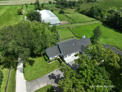 an aerial view of house with yard