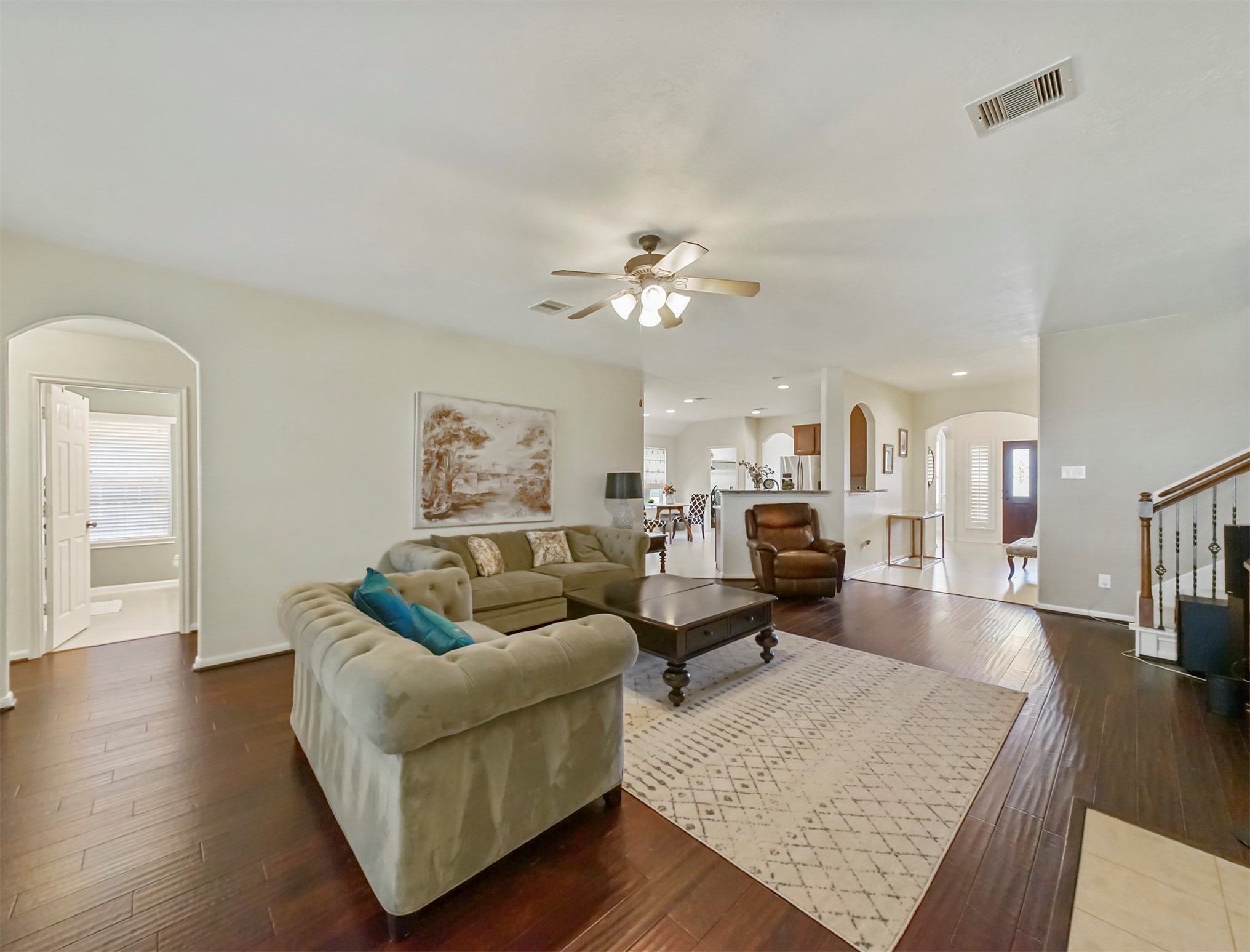8214 Garrison Point Drive Houston, TX 77040 - Photo 11 of 37 a living room with furniture and wooden floor
