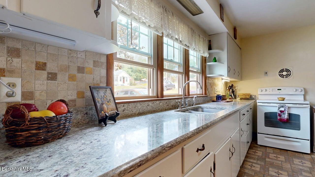 16 Anthony Street Adams, MA 01220 - Photo 6 of 33 a kitchen that has a sink and a stove