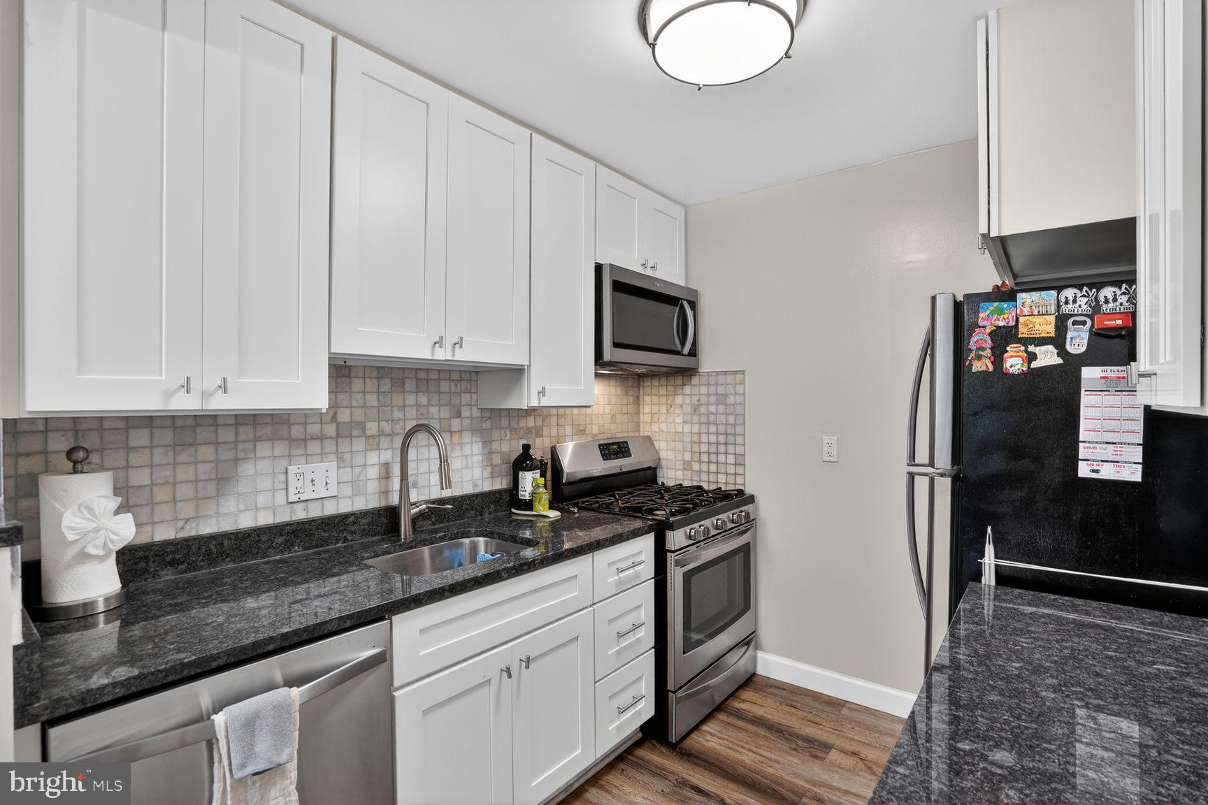 2911 Charing Cross Road, Unit 8 Falls Church, VA 22042 - Photo 13 of 23 Kitchen stainless appliances granite counters