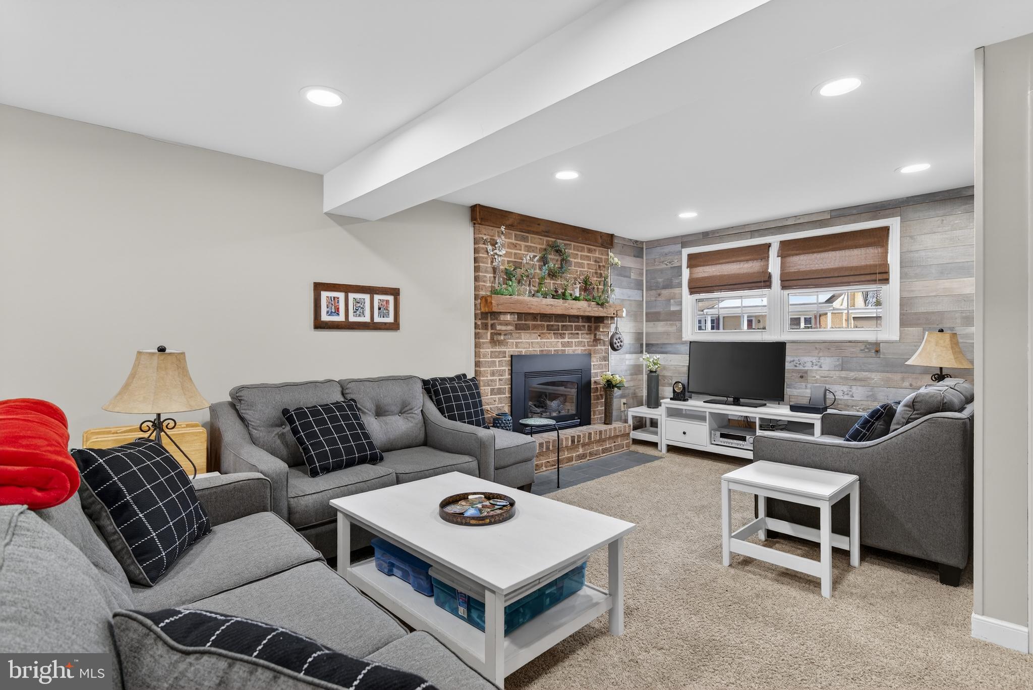 146 South Oak Street Lititz, PA 17543 - Photo 32 of 55 a living room with furniture a fireplace and a table