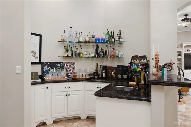 a kitchen with sink and cabinets