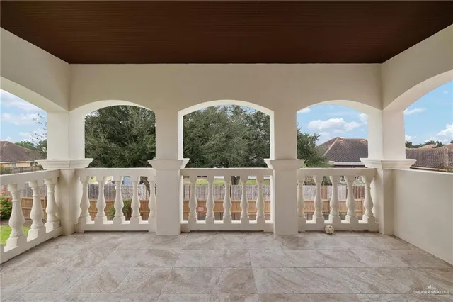 a view of a two room with large windows