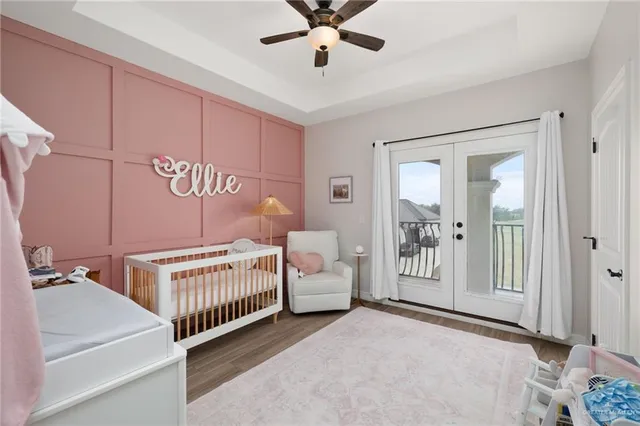 a bedroom with a white bed and white walls
