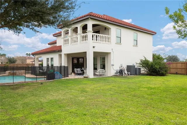 a front view of a house with swimming pool
