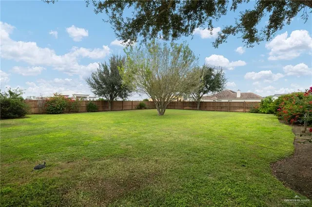 a view of outdoor space with deck and yard