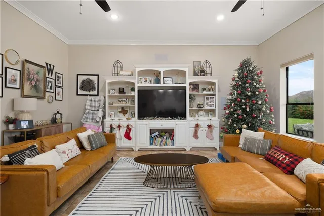 a living room with furniture and a flat screen tv