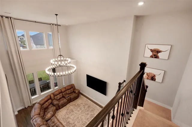 a bedroom with furniture and a chandelier