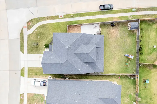 a aerial view of a house with a swimming pool