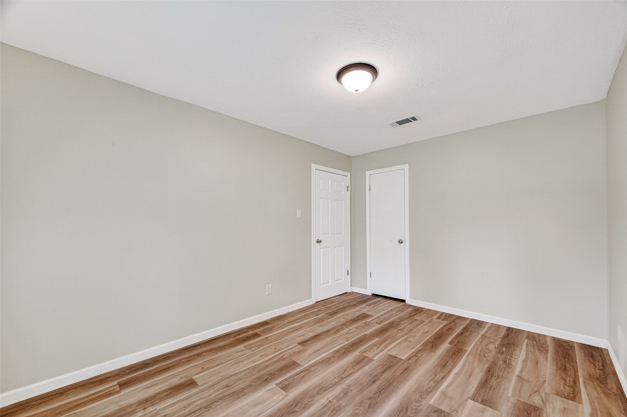 25503 Foxbriar Lane Spring, TX 77373 - Photo 29 of 45 a view of a room with wooden floor and white walls