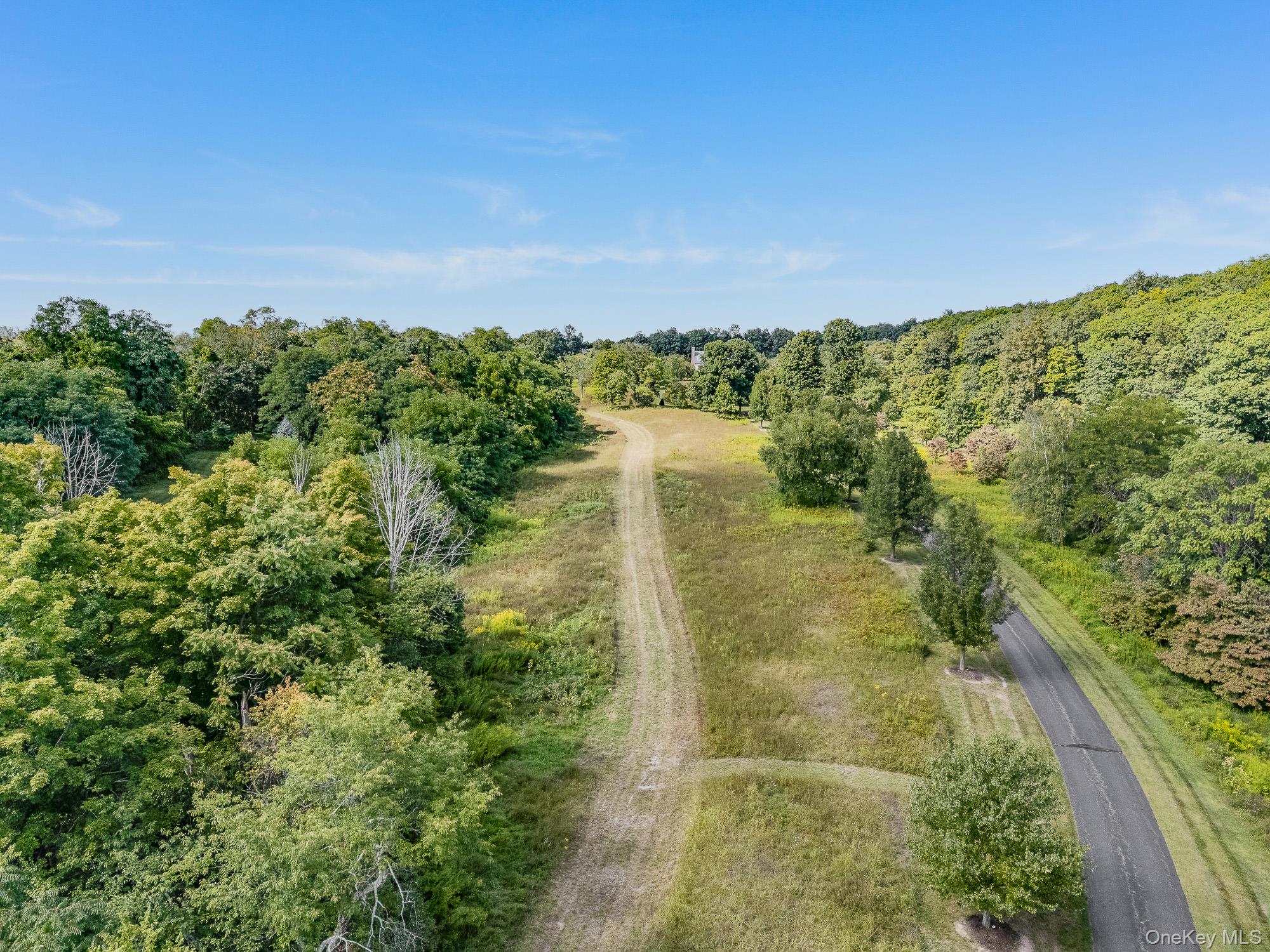 31 Oak Grove Road Clinton Corners, NY 12514 - Photo 11 of 15 a view of a lake with a yard