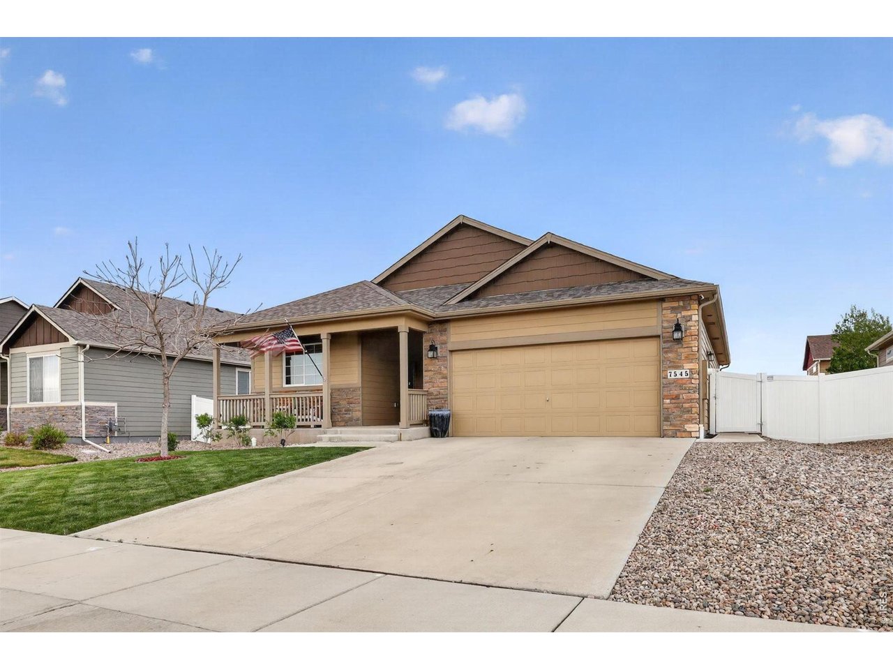 7545 McClellan Road Wellington, CO 80549 - Photo 2 of 42 Driveway with 2-car garage and updated light fixtures