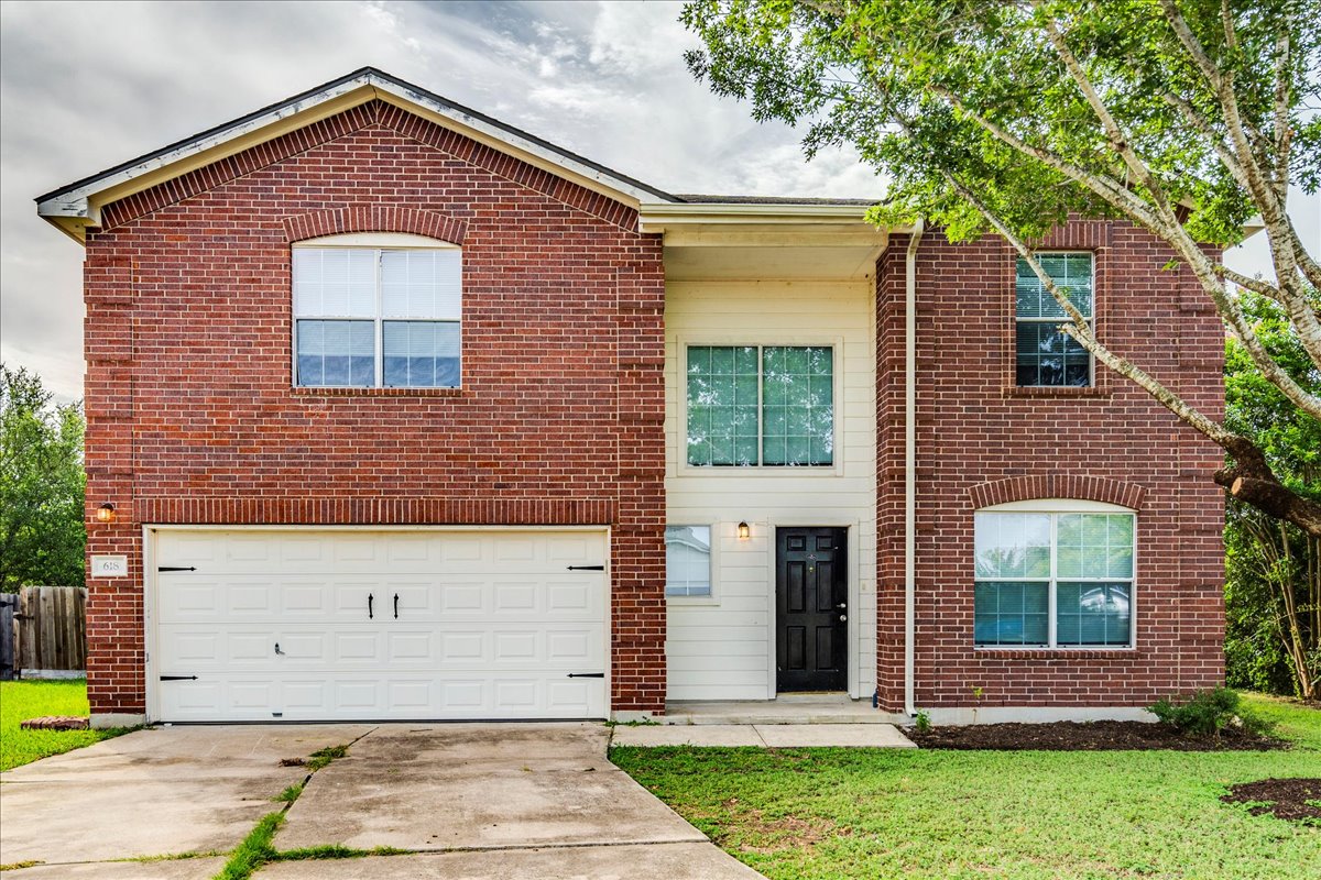 2 car garage, brick siding and double pane windows.