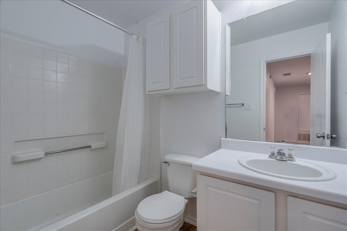618 Lavaca Loop Elgin, TX 78621 - Photo 23 of 30 Full bath featuring vanity and shower / tub combo with curtain