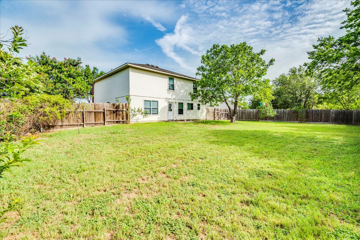 618 Lavaca Loop Elgin, TX 78621 - Photo 28 of 30 Rear view of property with a fenced backyard